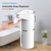 Automatic foaming soap dispenser on bathroom sink